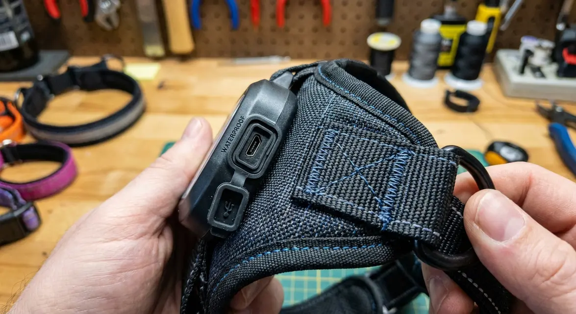 Close-up of light up dog harness waterproof charging port and durable stitching